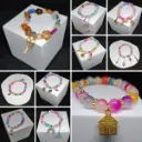 Pulsera de Cuentas Vidrio  y Dije Expresivo · 3x2